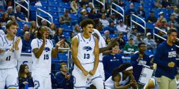Freshman forward Kade Snyder (#13) celebrates alongside teammates, freshman guard SJ Madison (#15)and freshman forward Hudson Lucas (#11) at Lawlor Event Center on Sunday, Oct. 25.