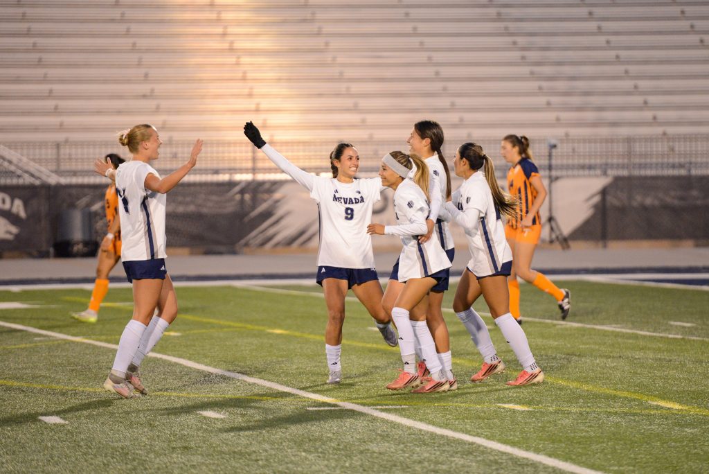 The Wolf Pack celebrate junior forward Carmen Coronado's goal to make the score 1-0, against the UTEP Miners at Mackay Stadium on Wednesday, Oct. 28. (Max Alexander/Nevada Sagebrush)