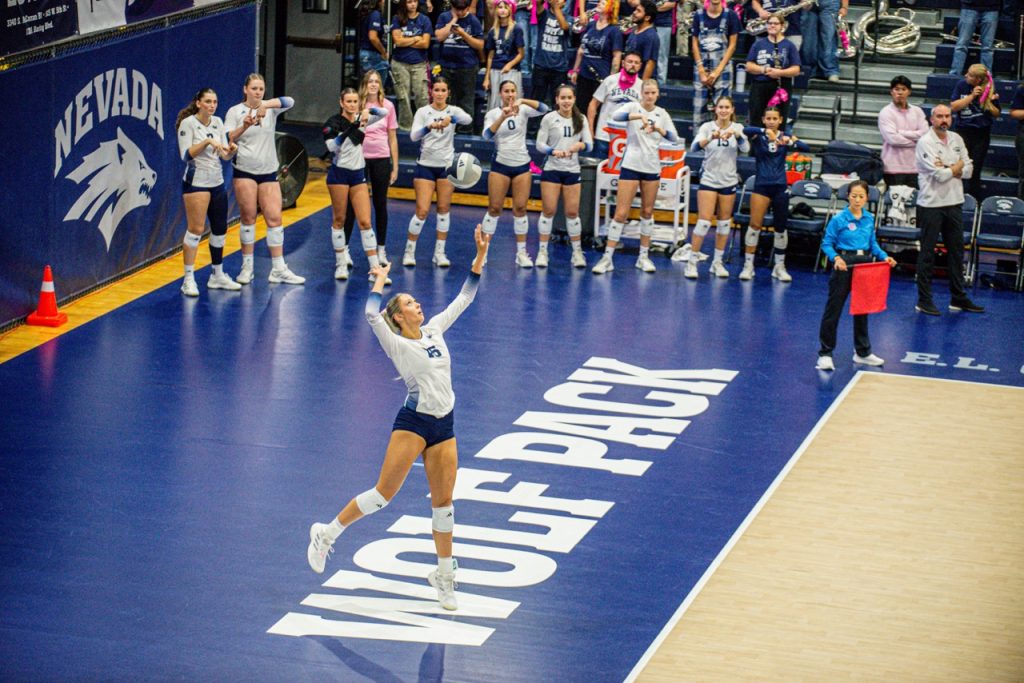 Sophomore outside hitter Kamryn Tift prepares to serve the ball into play.
