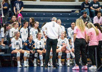 Head Coach Jason Borchin talks to his teams during a timeout.