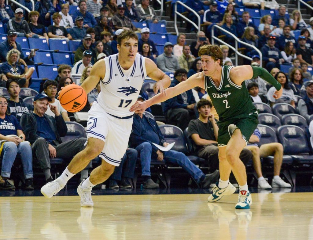 Sophomore guard Peyton White presses through defense towards the hoop at Lawlor Event Center on Sunday, Oct. 25.