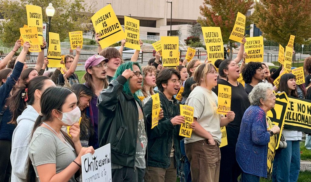 Protestors holding signs and chanting on the Joe Crowley Lawn on Monday, Oct. 5, 2026.