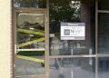 Nevada’s Recovery and Prevention Program’s (NRAP) office door decorated with cobwebs and caution tape for Halloween.