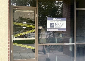 Nevada’s Recovery and Prevention Program’s (NRAP) office door decorated with cobwebs and caution tape for Halloween.