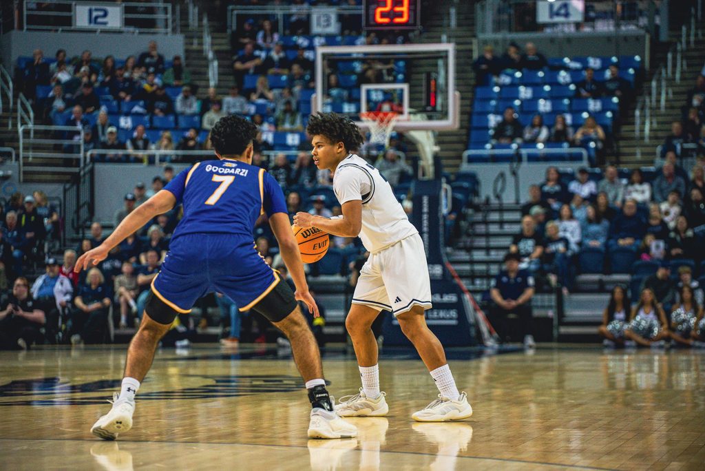 Myles Walker dribbles.