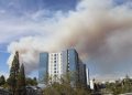 Smoke looms over a student apartment building.