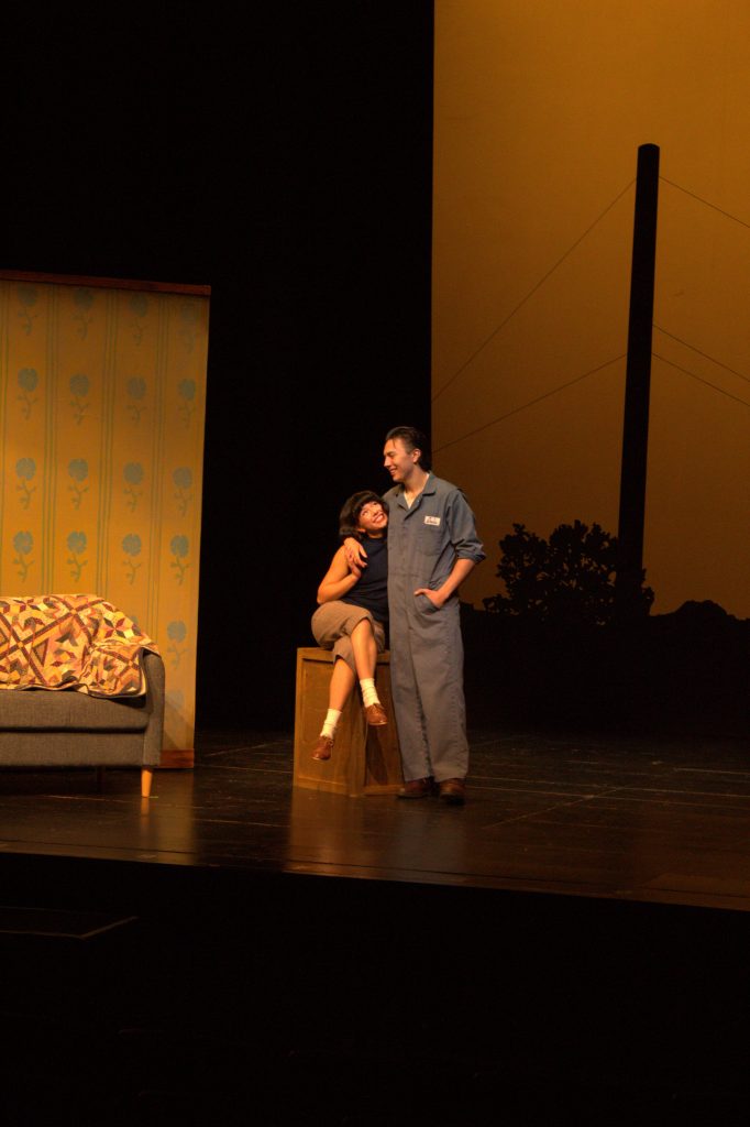 Actors embracing during a scene.