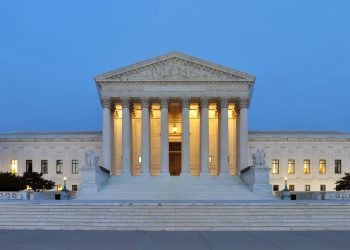 The United State Supreme Court building at dusk.