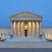 The United State Supreme Court building at dusk.