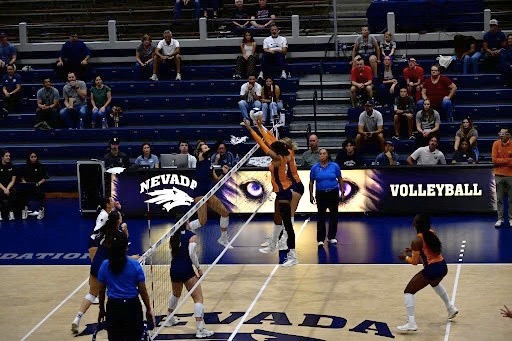 Outside Hitter Mckaley Herr (#2) attempts a kill on UTEPs Middle Blocker Sydney Frazier (#3) on Oct. 10 at the Virginia Street Gym.