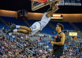 Nevada senior forward Vaughn Weems dunks the ball over Utah freshman forward Alec Anigbata  at Lawlor Events Center on Saturday, Oct. 17.