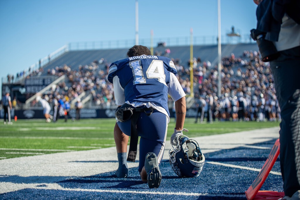 Nevada sixth-year kick returner Gerick Robinson kneels on the sidelines during the first quarter on Saturday, Oct. 24 at Mackay Stadium.