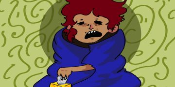 Freshman wrapped up in a blanket sick with a box of tissues.