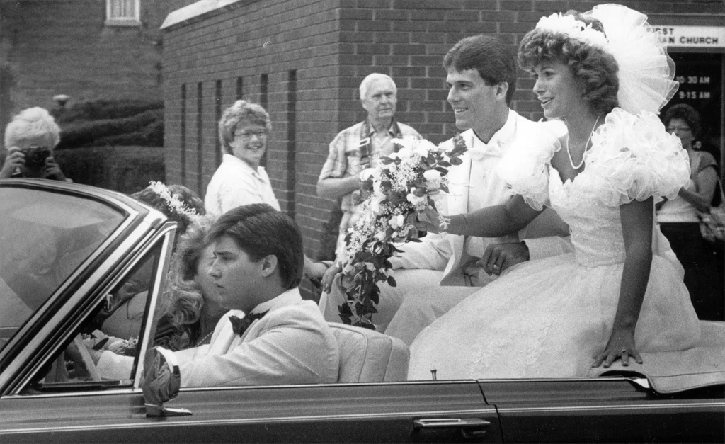 The newlywed Alfords on their way to their reception, following their wedding ceremony.