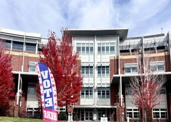 A flag reading “Vote Here” in front of the Joe Crowley Student Union on Oct. 29, 2026.