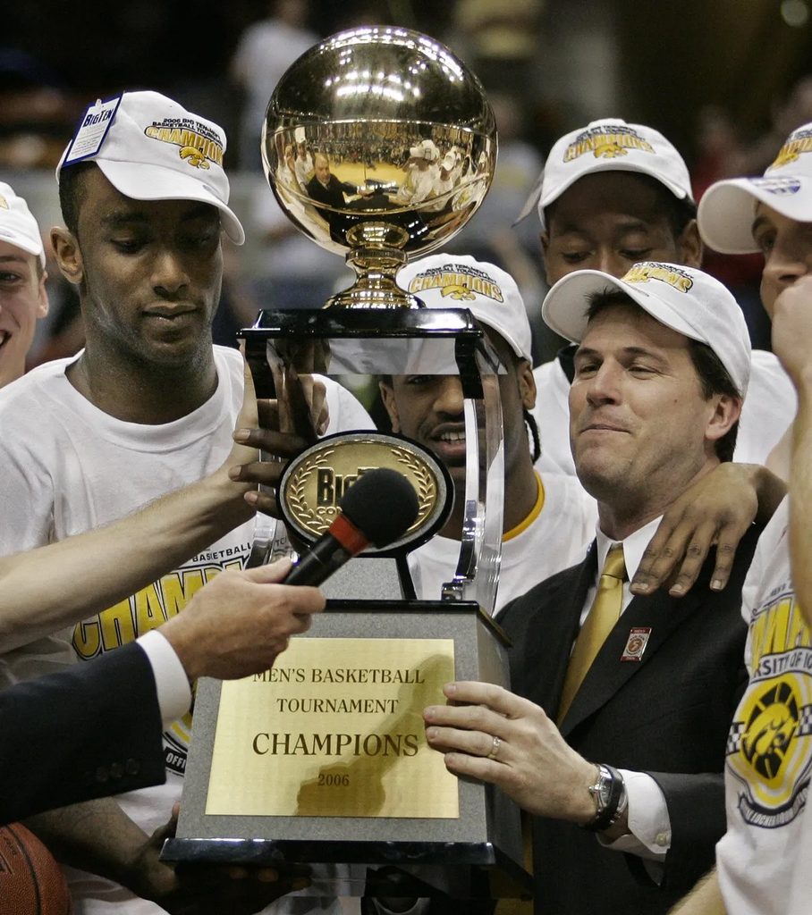 Alford hoisting the Big 10 conference championship trophy at Iowa.
