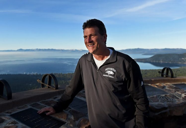 Alford standing, with Lake Tahoe in the background.