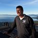 Alford standing, with Lake Tahoe in the background.