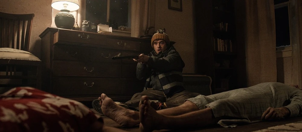 Bryan kills an infected couple with a shotgun. (Sony Pictures)